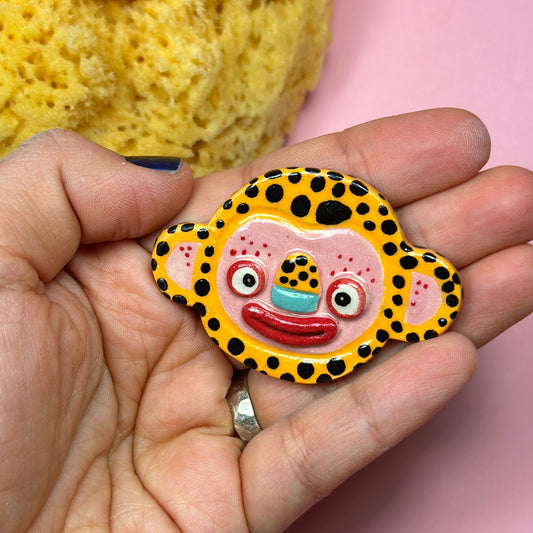 Ceramic brooch "Floppy-eared leopard"