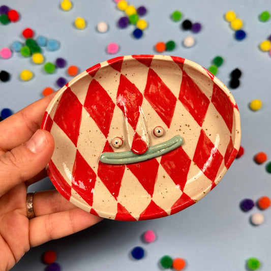 Soap dish in a red harlequin pattern