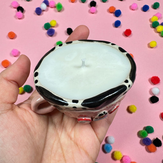 A lop-eared candle with the scent of sweet cookies