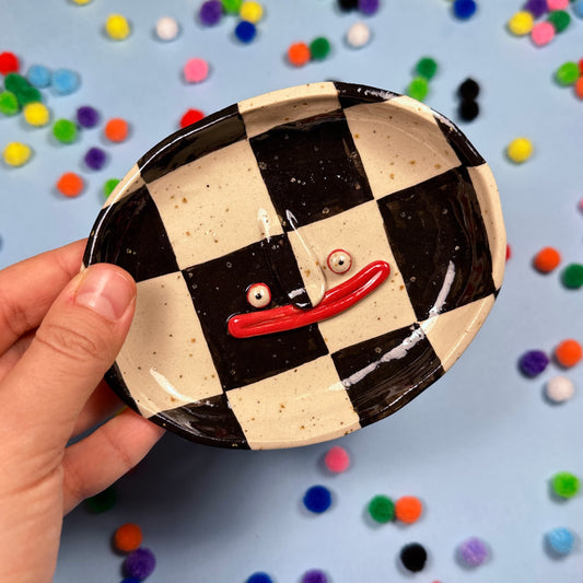 Soap dish with a checkered pattern